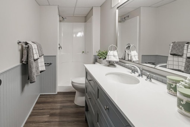 5445 Large Ave NE, Albertville, MN 55301 - bathroom featuring a paneled ceiling, vanity, a shower, wood finished floors, and a wainscoted wall