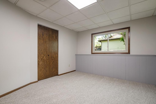 5445 Large Ave NE, Albertville, MN 55301 - spare room with a paneled ceiling, carpet, and a wainscoted wall