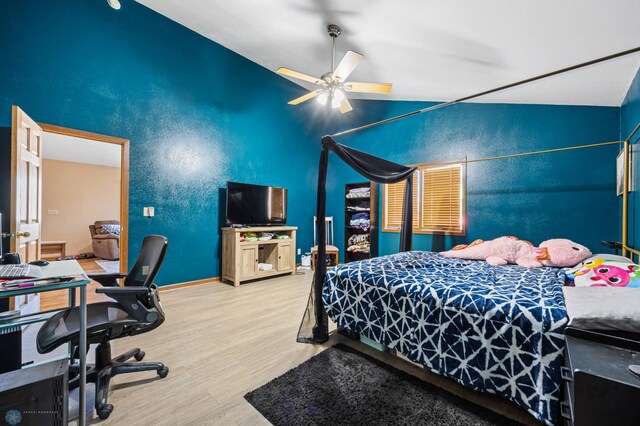 362 5th Ave N, Casselton, ND 58012 - bedroom with wood finished floors, lofted ceiling, a desk, and a ceiling fan