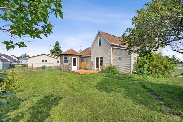 362 5th Ave N, Casselton, ND 58012 - rear view of house with a wooden deck and roof with shingles