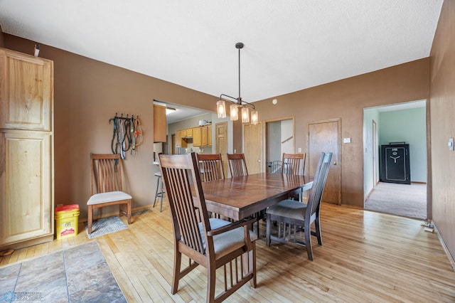 362 5th Ave N, Casselton, ND 58012 - dining area featuring light wood-style flooring and baseboards