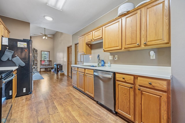 362 5th Ave N, Casselton, ND 58012 - kitchen featuring stainless steel appliances, ceiling fan, light wood finished floors, and light countertops