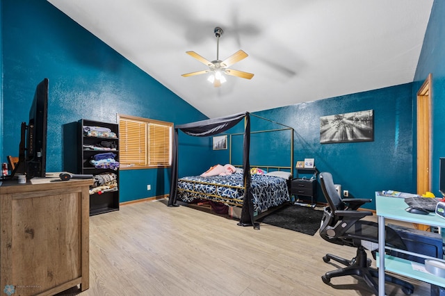 362 5th Ave N, Casselton, ND 58012 - bedroom featuring vaulted ceiling, wood finished floors, an office area, and ceiling fan