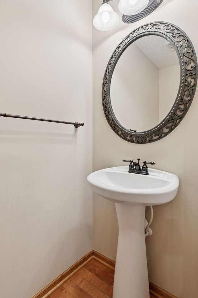 1767 Switchgrass Ct, Shakopee, MN 55379 - bathroom featuring wood finished floors and baseboards