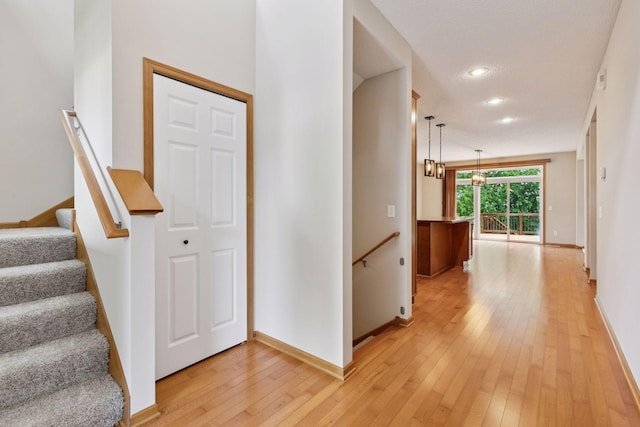 1767 Switchgrass Ct, Shakopee, MN 55379 - hall featuring light wood-style flooring, an upstairs landing, and recessed lighting