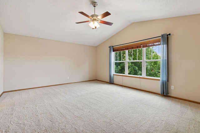 1767 Switchgrass Ct, Shakopee, MN 55379 - spare room featuring vaulted ceiling, carpet, and a ceiling fan