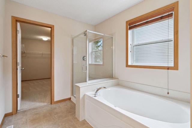 1767 Switchgrass Ct, Shakopee, MN 55379 - full bathroom with a bath, a shower stall, and a spacious closet