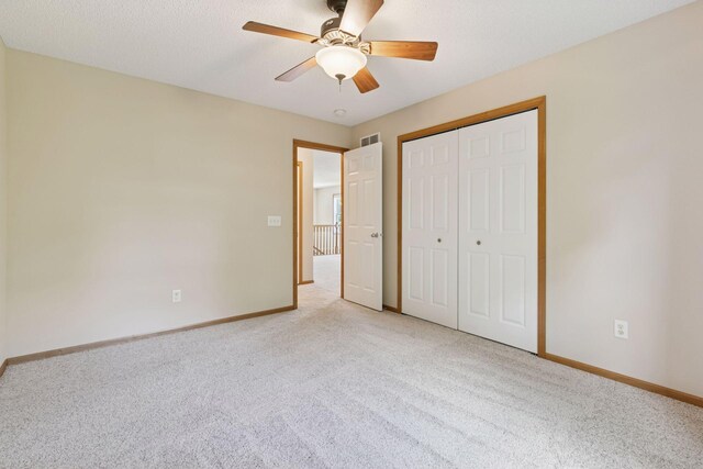 1767 Switchgrass Ct, Shakopee, MN 55379 - unfurnished bedroom with light carpet, a closet, and a ceiling fan