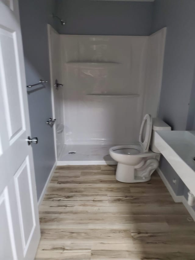 1884 Ames Ave, Saint Paul, MN 55119 - full bath featuring a shower stall, wood finished floors, and vanity