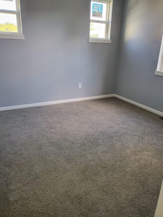1884 Ames Ave, Saint Paul, MN 55119 - spare room with carpet and baseboards