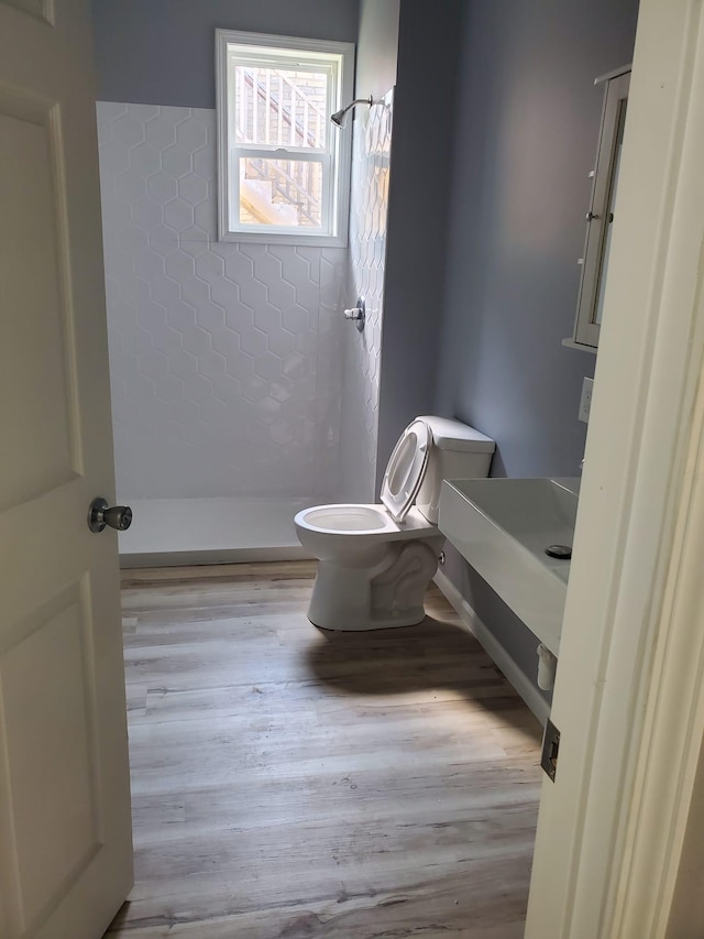 1884 Ames Ave, Saint Paul, MN 55119 - bathroom featuring a stall shower, wood finished floors, and vanity