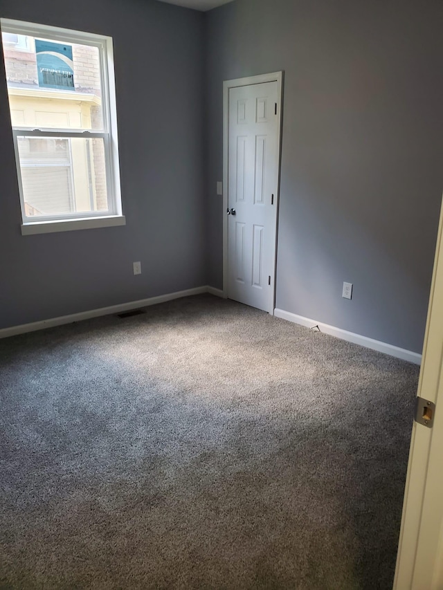 1884 Ames Ave, Saint Paul, MN 55119 - spare room featuring carpet and baseboards