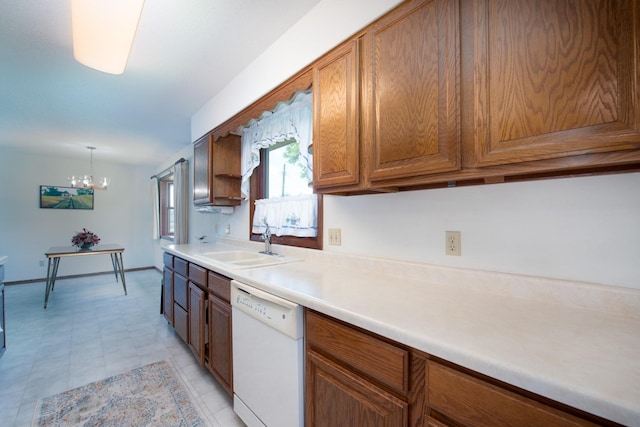 608 Pfau St, Mankato, MN 56001 - kitchen featuring dishwasher, light countertops, a chandelier, brown cabinets, and decorative light fixtures