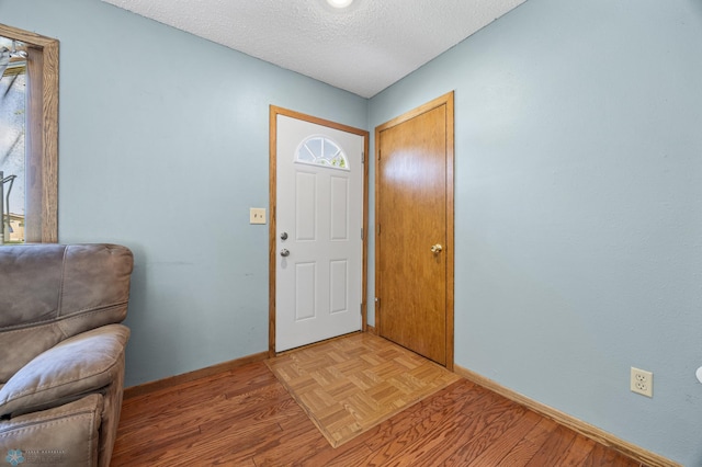 901 7th St W, West Fargo, ND 58078 - entrance foyer with a textured ceiling and light wood-type flooring