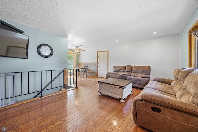 901 7th St W, West Fargo, ND 58078 - living area with wood-type flooring, a textured ceiling, and ceiling fan