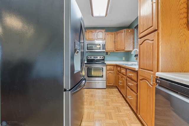 901 7th St W, West Fargo, ND 58078 - kitchen with appliances with stainless steel finishes and light countertops