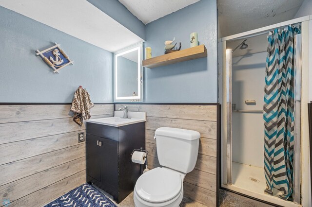 901 7th St W, West Fargo, ND 58078 - full bathroom with a stall shower, vanity, a wainscoted wall, and wooden walls