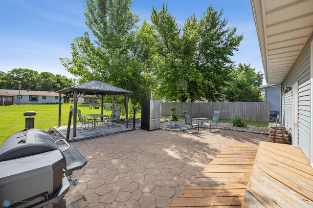 901 7th St W, West Fargo, ND 58078 - view of patio / terrace with a gazebo, area for grilling, outdoor dining space, and a deck