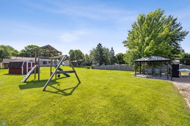 901 7th St W, West Fargo, ND 58078 - view of yard featuring a gazebo, a storage shed, a playground, and a patio