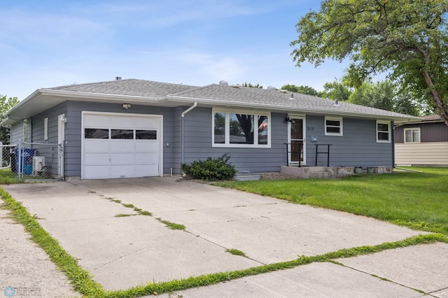 3113 8th St N, Fargo, ND 58102 - ranch-style home featuring an attached garage, concrete driveway, and a gate
