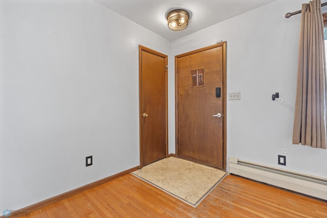 3113 8th St N, Fargo, ND 58102 - entryway with baseboard heating and light wood-style floors