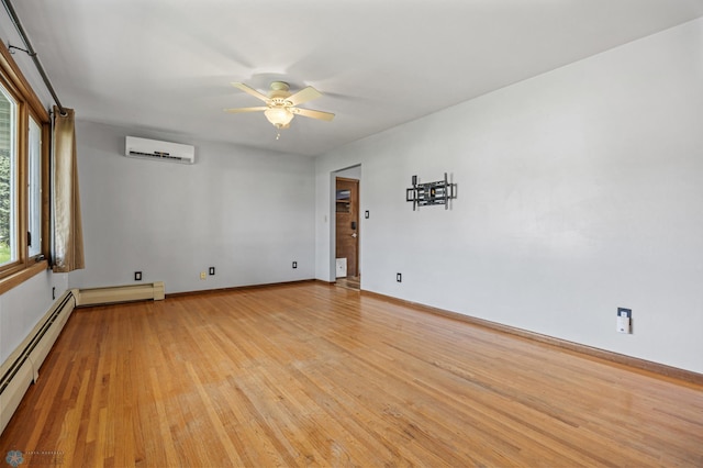 3113 8th St N, Fargo, ND 58102 - unfurnished room featuring an AC wall unit, a baseboard radiator, light wood-style floors, and a ceiling fan