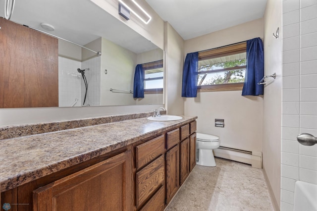 3113 8th St N, Fargo, ND 58102 - full bathroom with a baseboard radiator, vanity, and shower / bathtub combination