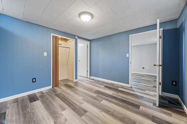 3113 8th St N, Fargo, ND 58102 - unfurnished room featuring wood finished floors and baseboards