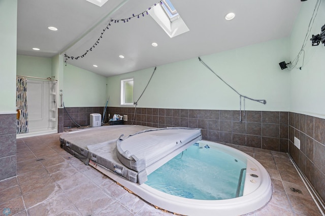 3113 8th St N, Fargo, ND 58102 - view of swimming pool featuring a skylight and an indoor hot tub