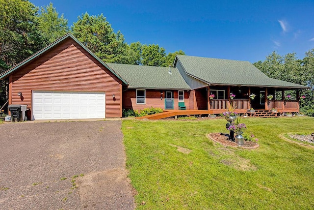 417 Whiskey Rd SW, Isanti, MN 55040 - view of front facade with asphalt driveway, a garage, a shingled roof, and a front lawn