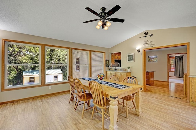 417 Whiskey Rd SW, Isanti, MN 55040 - dining area featuring vaulted ceiling, light wood-style flooring, and ceiling fan