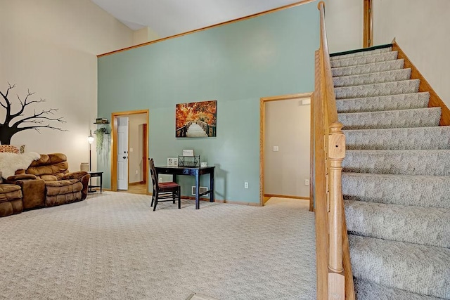 417 Whiskey Rd SW, Isanti, MN 55040 - carpeted living room featuring a high ceiling and stairway