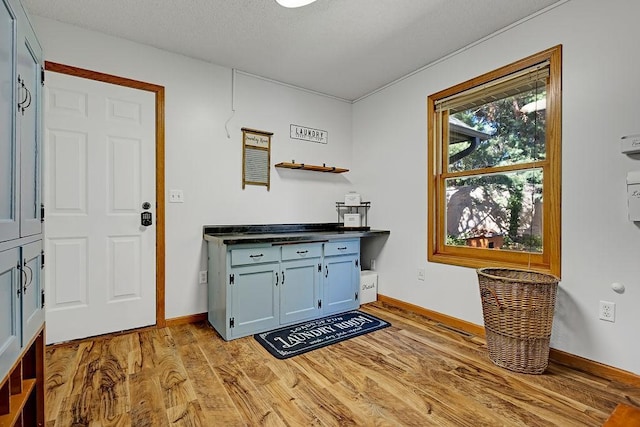 417 Whiskey Rd SW, Isanti, MN 55040 - bar featuring light wood finished floors and baseboards