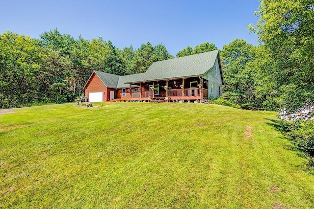 417 Whiskey Rd SW, Isanti, MN 55040 - view of front of house featuring a garage, a front lawn, and a wooden deck