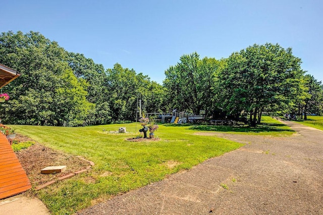 417 Whiskey Rd SW, Isanti, MN 55040 - view of green lawn with a playground
