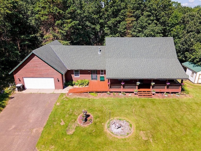 417 Whiskey Rd SW, Isanti, MN 55040 - view of front of house featuring driveway, a front yard, a wooden deck, and a garage