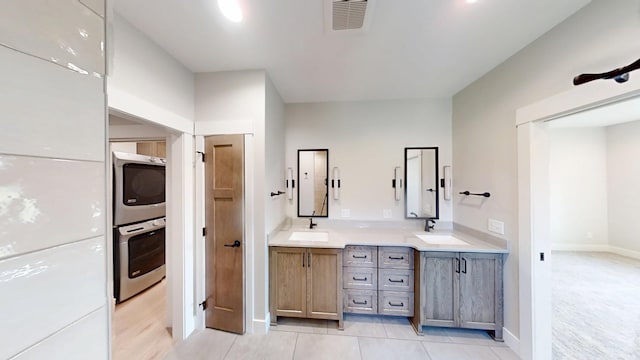2330 9th St W, Albert Lea, MN 56007 - full bathroom featuring double vanity and tile patterned flooring
