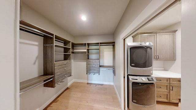 2330 9th St W, Albert Lea, MN 56007 - spacious closet featuring stacked washer / drying machine and light wood finished floors