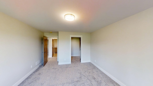 2330 9th St W, Albert Lea, MN 56007 - unfurnished bedroom with light colored carpet and a spacious closet