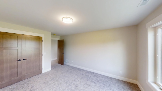 2330 9th St W, Albert Lea, MN 56007 - unfurnished bedroom with carpet floors and a closet