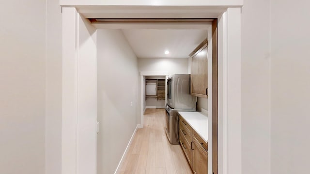 2330 9th St W, Albert Lea, MN 56007 - laundry area with cabinet space, light wood-type flooring, washing machine and clothes dryer, and recessed lighting