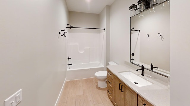 2330 9th St W, Albert Lea, MN 56007 - bathroom with vanity, wood finished floors, and washtub / shower combination