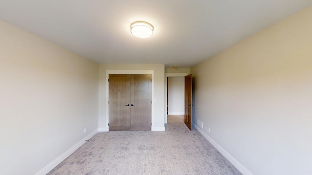 2330 9th St W, Albert Lea, MN 56007 - hallway featuring light carpet and baseboards