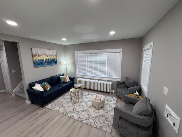 4644 Lyndale Ave S, Minneapolis, MN 55419 - living room featuring radiator, wood finished floors, recessed lighting, and stairs