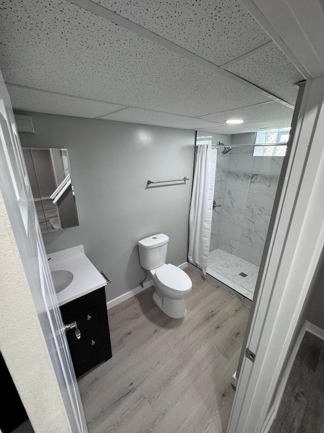 4644 Lyndale Ave S, Minneapolis, MN 55419 - full bath with a stall shower, vanity, a drop ceiling, and wood finished floors