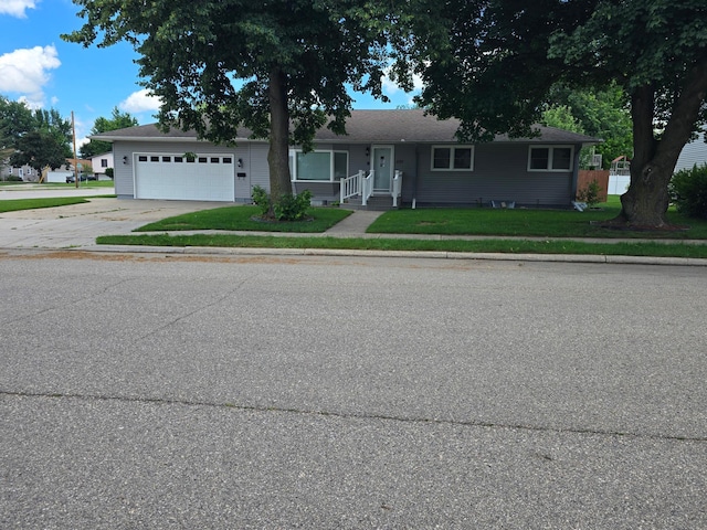 1101 7th Ave SW, Pipestone, MN 56164 - ranch-style house with a garage, concrete driveway, and a front yard