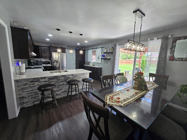1101 7th Ave SW, Pipestone, MN 56164 - dining room featuring dark wood-type flooring and recessed lighting