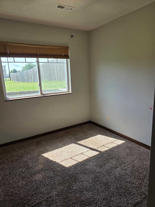1719 Grand Ave, Worthington, MN 56187 - carpeted spare room with baseboards