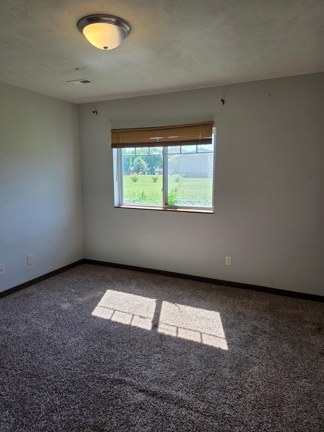 1719 Grand Ave, Worthington, MN 56187 - unfurnished room with carpet and baseboards