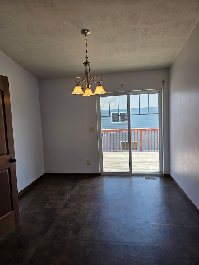 1719 Grand Ave, Worthington, MN 56187 - empty room featuring a chandelier and a textured ceiling